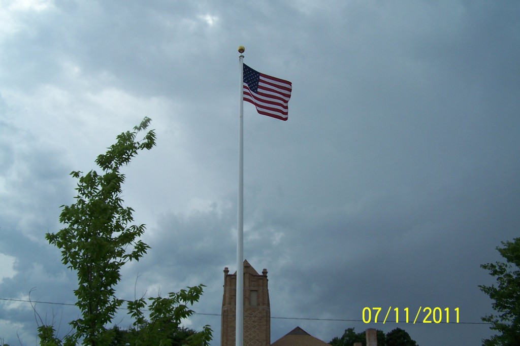 American flag waving at top of flagpole