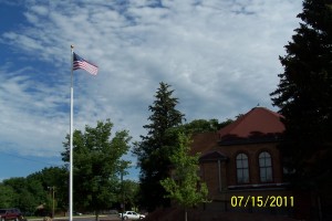 Flag waving atop flagpole