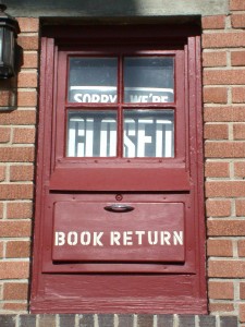 red door of library with book return door in lower panel